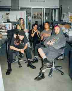 No Vacation pose seated in office chairs