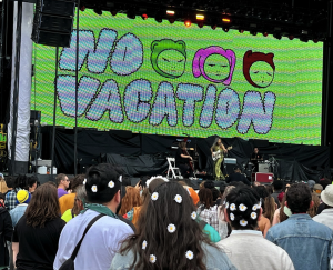 An onstage pic at Outside Lands Festival of Alex playing the cello, Nat facing him on bass, and James int he background on drums
